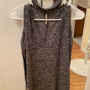 Cold shoulder long sleeved gray sweater.